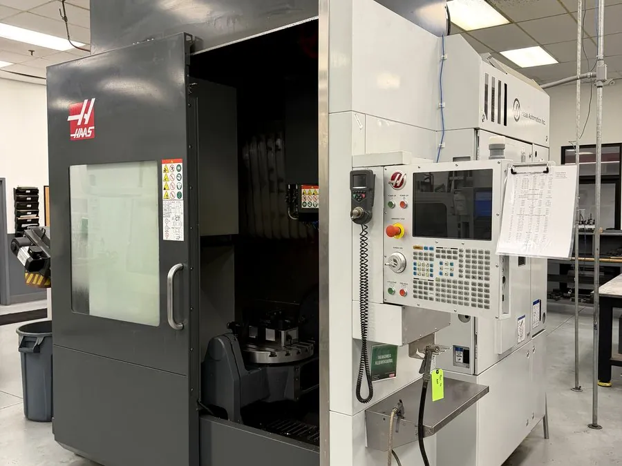Haas machining centre set and levelled on a shop floor